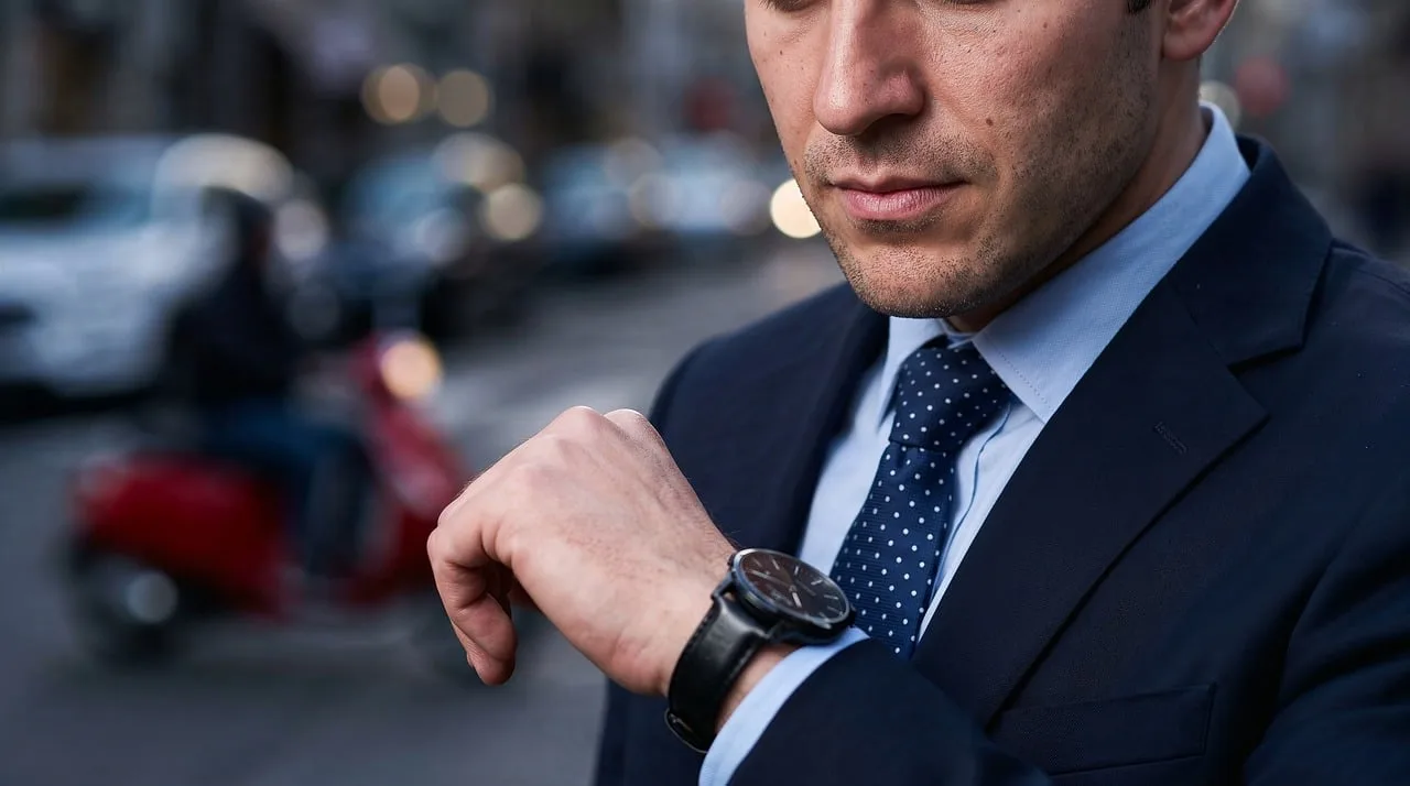 time, watch, business, man, suit, street scene, important, fashion, tie, arm positioning, focus, outdoor, serious, career, city, depth of field, red scooter, employee, leader, concentration
